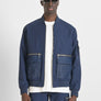 CHAQUETA EN TEJIDO IMPERMEABLE CON LOGOTIPO BORDADO EN EL PECHO