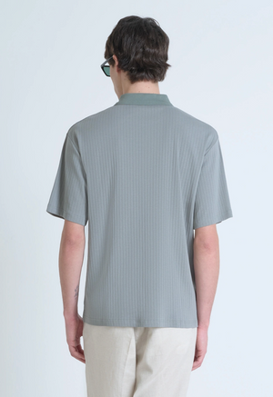 POLO RELAXED FIT DE ALGODÓN CON MOTIVO DE ESTIPES Y LOGOTIPO BORDADO