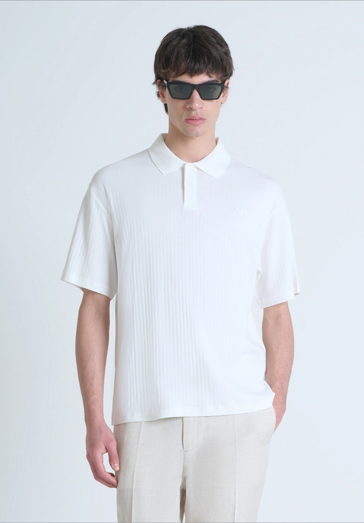 POLO RELAXED FIT DE ALGODÓN CON MOTIVO DE ESTIPES Y LOGOTIPO BORDADO