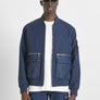 CHAQUETA EN TEJIDO IMPERMEABLE CON LOGOTIPO BORDADO EN EL PECHO