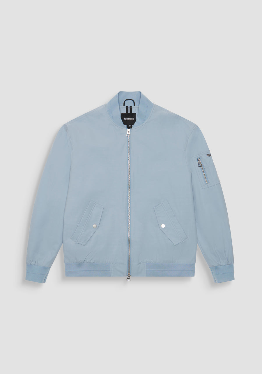 CHAQUETA REGULAR FIT DE COLOR LISO DE TEJIDO RIPSTOP