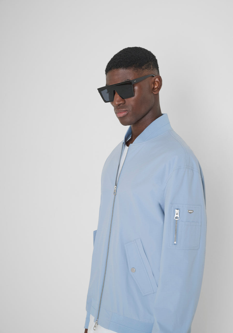 CHAQUETA REGULAR FIT DE COLOR LISO DE TEJIDO RIPSTOP