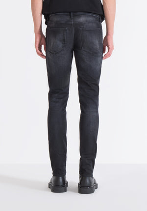 JEANS OZZY TAPERED FIT IN COATED BLACK BLACK DENIM