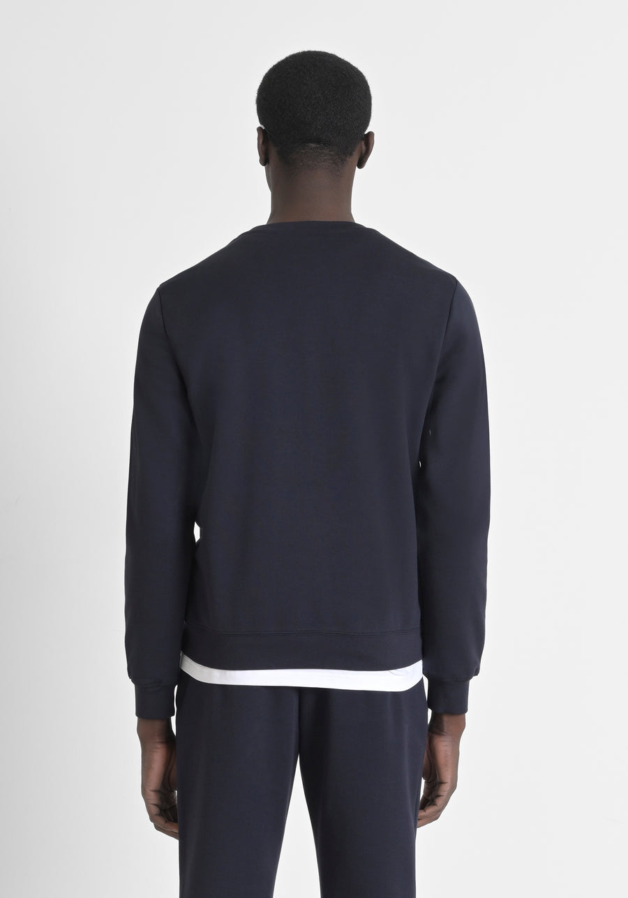 SUDADERA REGULAR FIT CON EFECTO ANTE CON INSERCIONES DE PIEL SINTÉTICA