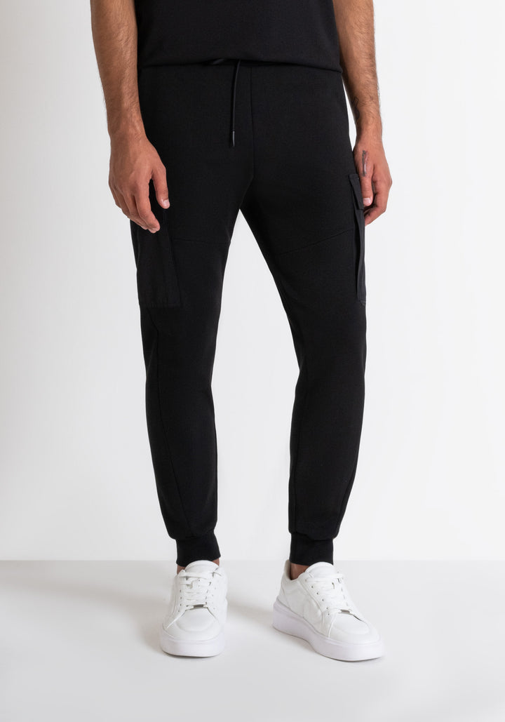 PANTALONES DE FELPA REGULAR FIT CON BOLSILLOS LATERALES