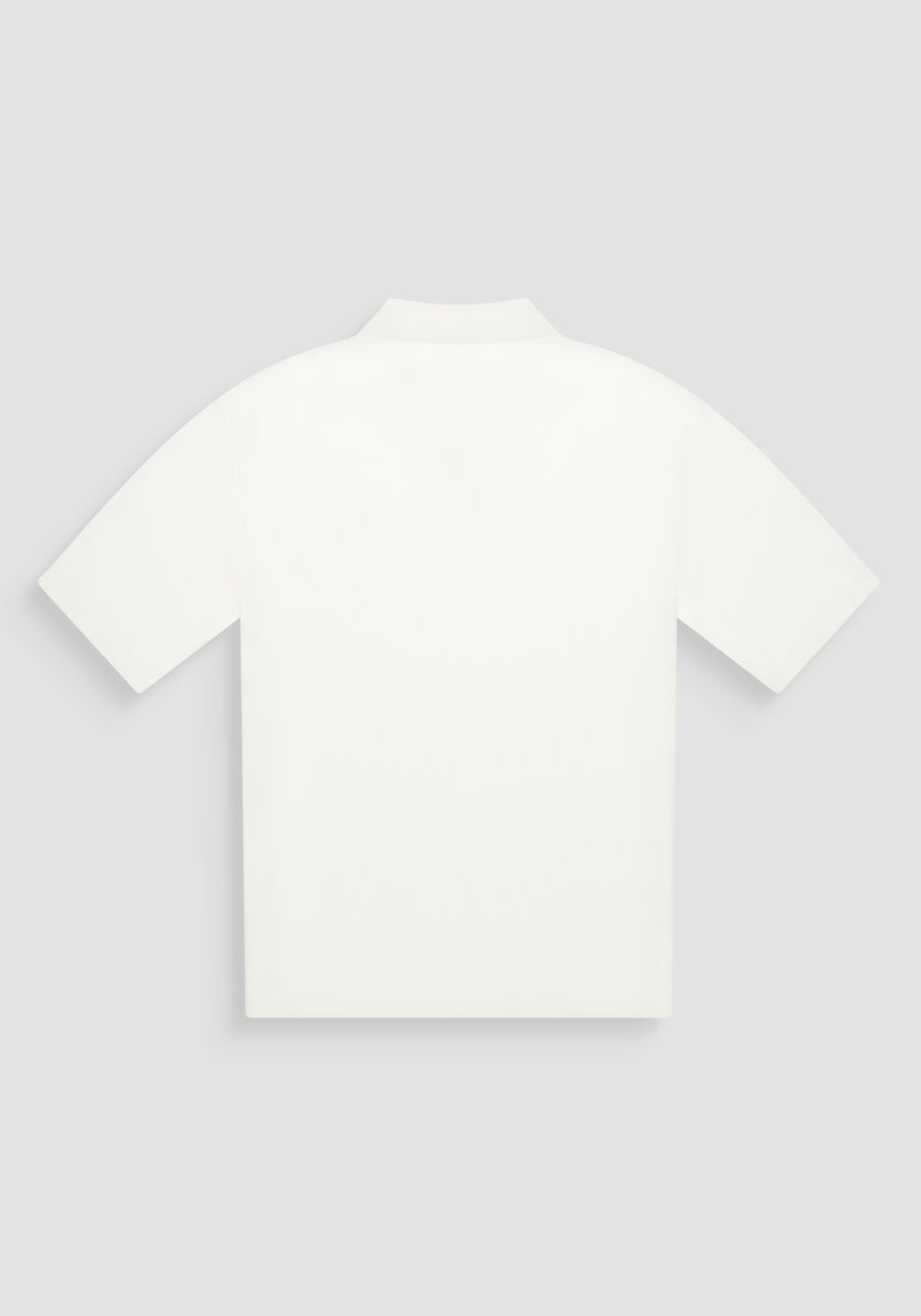 POLO RELAXED FIT DE ALGODÓN CON MOTIVO DE ESTIPES Y LOGOTIPO BORDADO