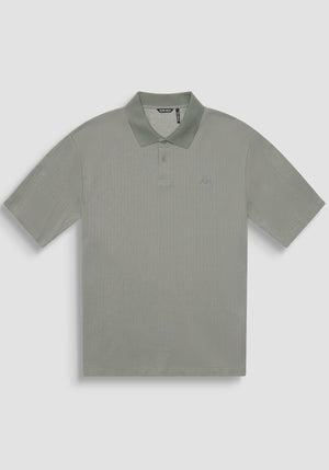 POLO RELAXED FIT DE ALGODÓN CON MOTIVO DE ESTIPES Y LOGOTIPO BORDADO