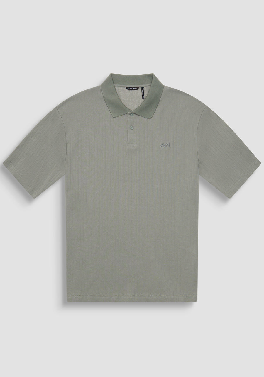 POLO RELAXED FIT DE ALGODÓN CON MOTIVO DE ESTIPES Y LOGOTIPO BORDADO