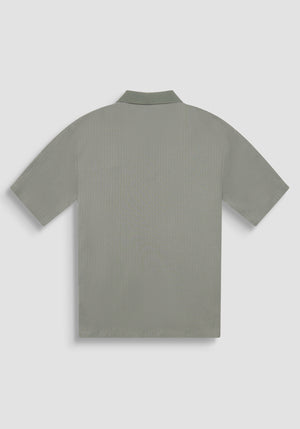 POLO RELAXED FIT DE ALGODÓN CON MOTIVO DE ESTIPES Y LOGOTIPO BORDADO