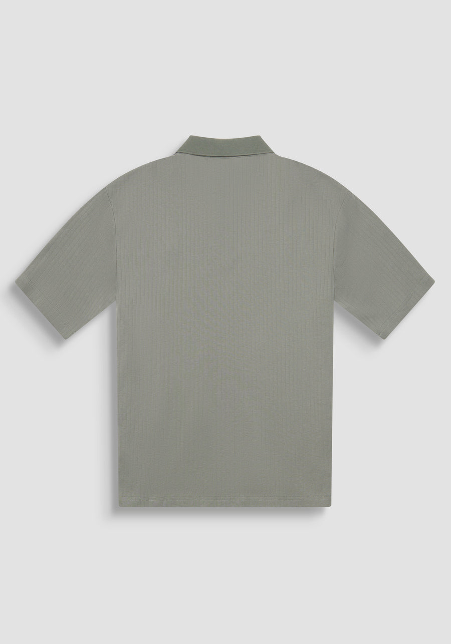 POLO RELAXED FIT DE ALGODÓN CON MOTIVO DE ESTIPES Y LOGOTIPO BORDADO