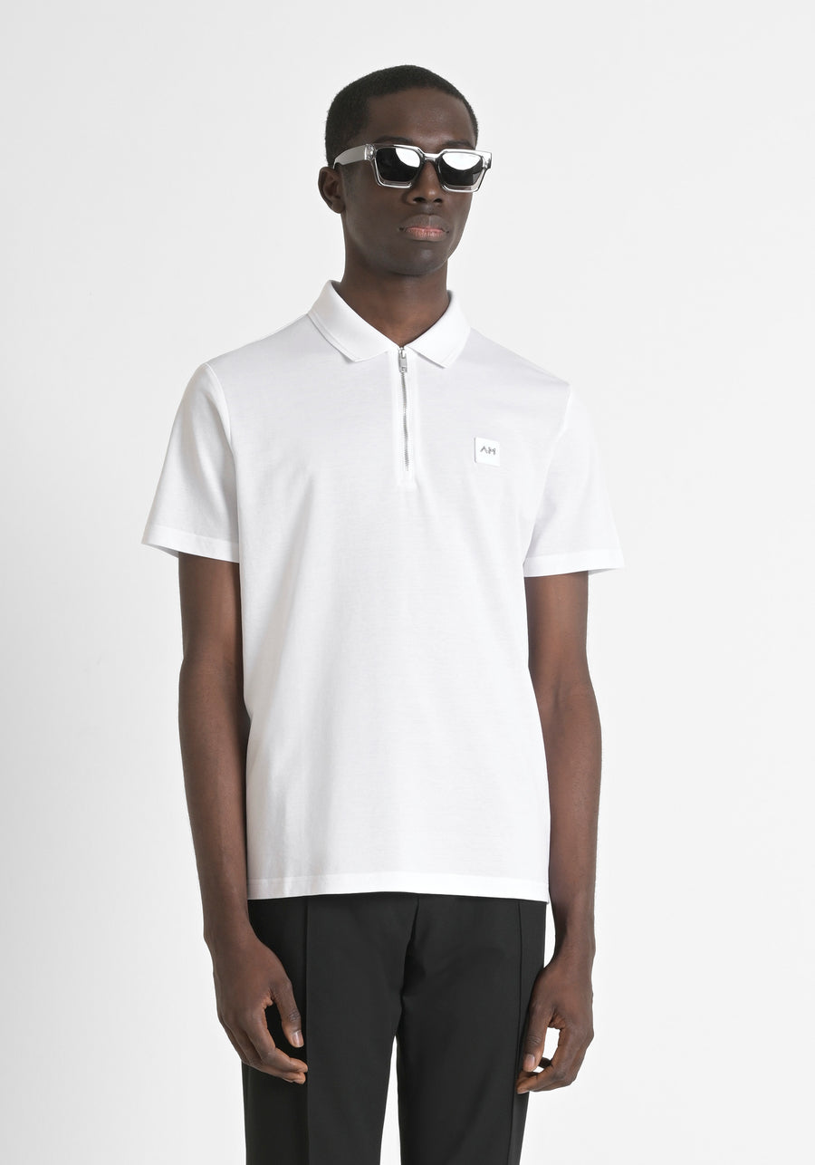 POLO REGULAR FIT DE PUNTO DE ALGODÓN 100 % CON PARCHE COSIDO Y MONOGOTIPO EN CONTRASTE