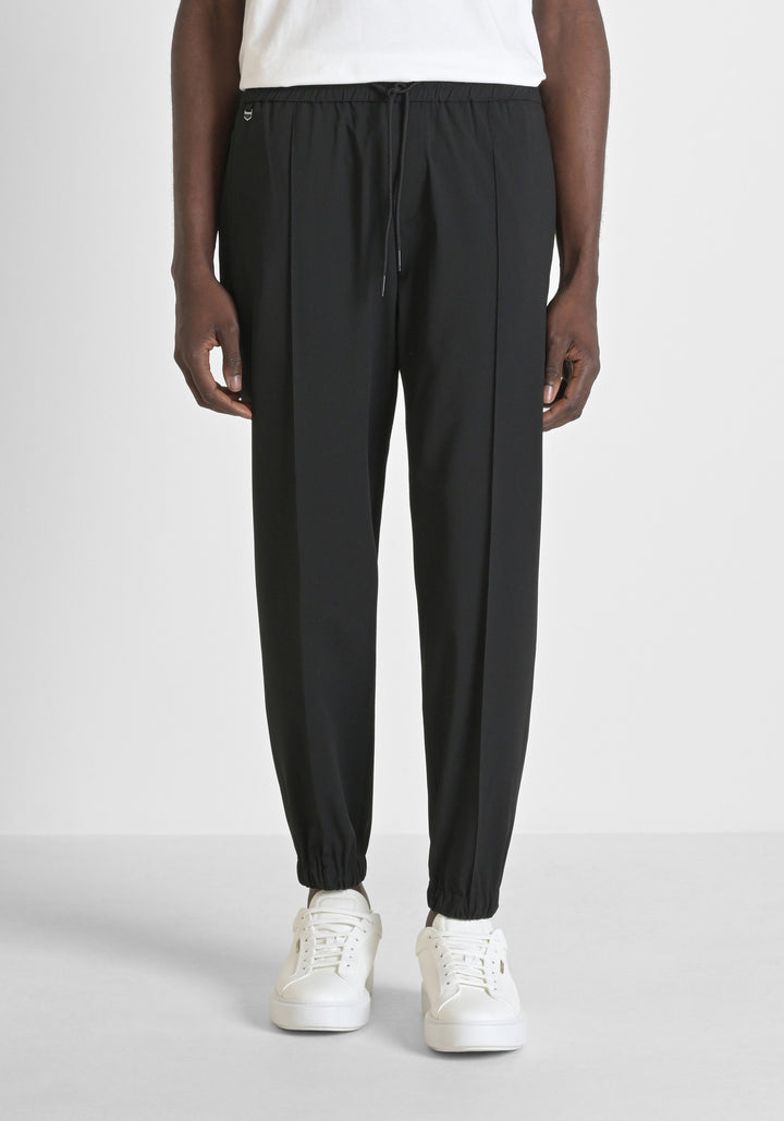 PANTALONES REGULAR FIT «NATE» DE MEZCLA DE VISCOSA ELÁSTICA